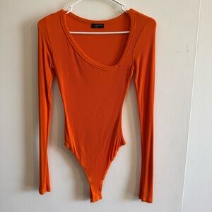 Naked Wardrobe Asymmetrical Orange Bodysuit